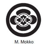 A black and white picture of the seal of m. Mokko