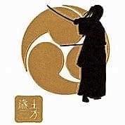 A person holding a sword in front of an asian symbol.